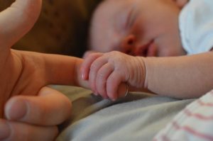 Portland homebirth baby, baby hand holding new mom
